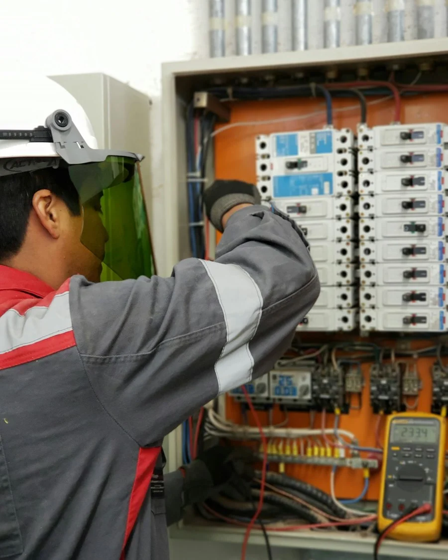 Trades professional working on an electrical panel